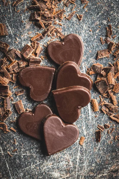 Sweet Chocolate Hearts Black Table Top View — Stock Photo, Image