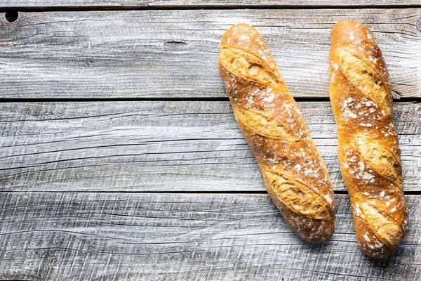 Two Crispy Fresh Baguettes Wooden Table Top View — Stock Photo, Image