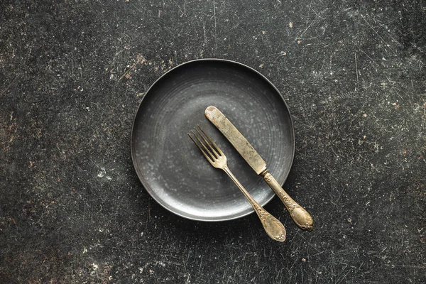 Empty Vintage Plate Silver Knife Fork Black Table Top View — Stock Fotó