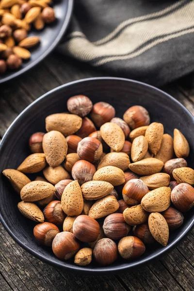 Unpeeled Hazelnuts Almonds Sweet Nuts Bowl Black Table — Stock Photo, Image