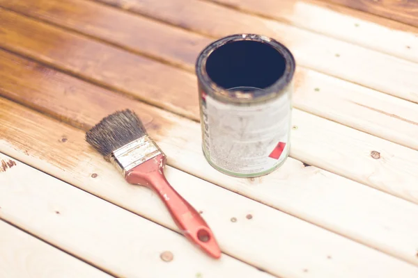 Painting wooden table using paintbrush — Stock Photo, Image