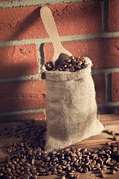 Coffee beans in sack — Stock Photo, Image