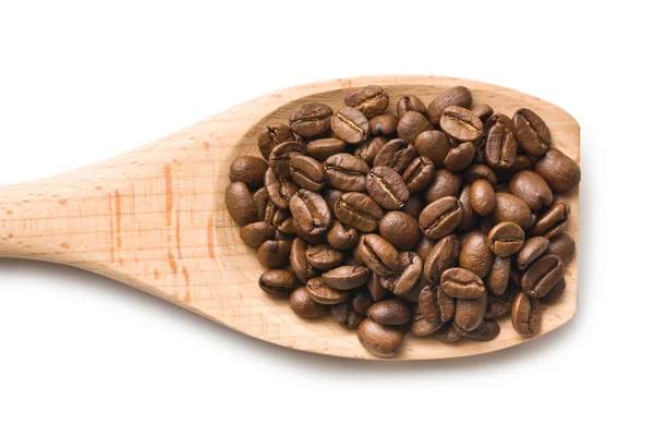 Koffiebonen in houten lepel — Stockfoto