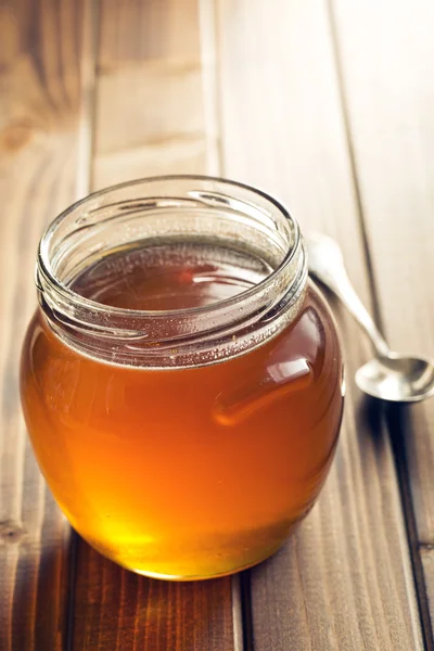 Miel en un frasco — Foto de Stock