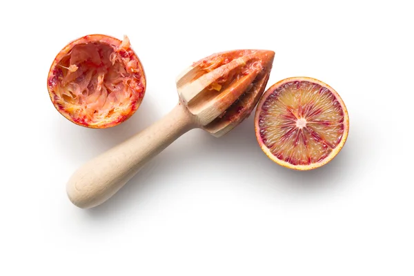 Halved blood orange and juicer — Stock Photo, Image