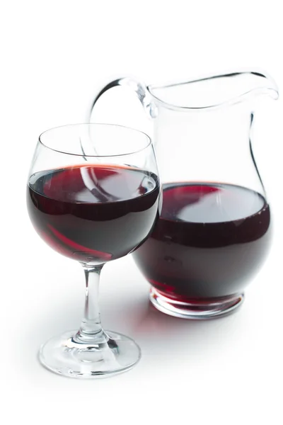 Glass of red wine with pitcher — Stock Photo, Image