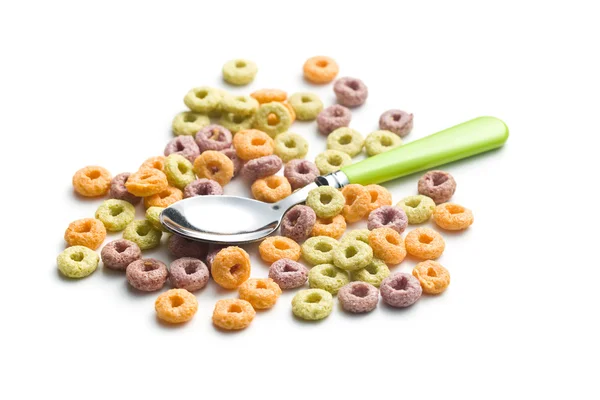 Colorful cereal rings and spoon — Stock Photo, Image