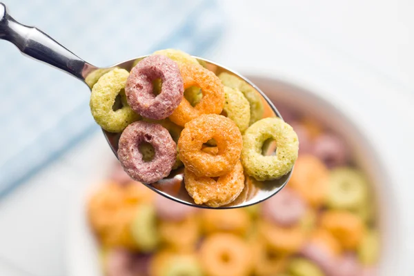 Colorful cereal rings in spoon — Stock Photo, Image