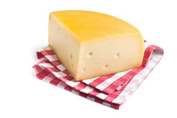 Edammer kaas op geruite servet — Stockfoto