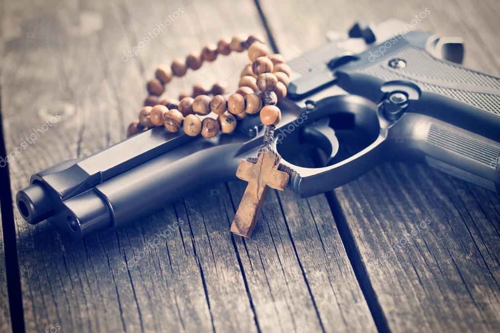 Rosary beads and gun Stock Photo by ©jirkaejc 75323591