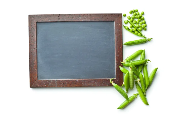 빈 칠판과 녹색 완두콩 — 스톡 사진