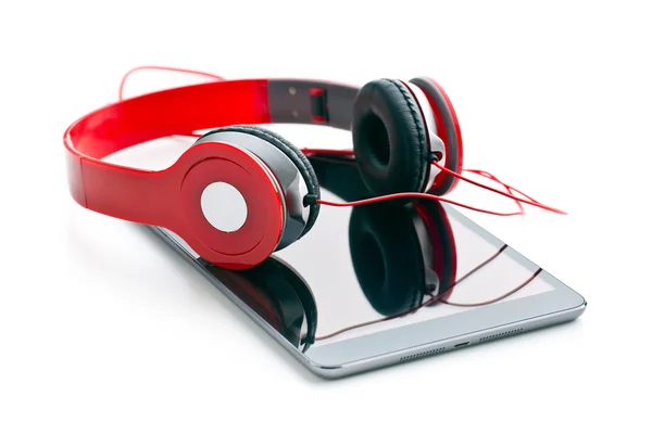 Computer tablet with headphones — Stock Photo, Image