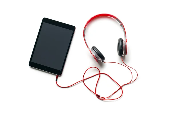 Computer tablet with headphones — Stock Photo, Image