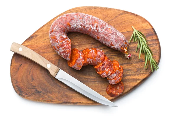 Sliced chorizo sausage and cutting board — Stock Photo, Image