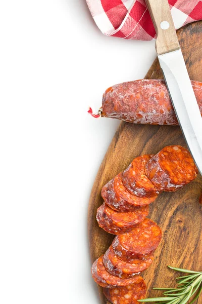 Sliced chorizo sausage and cutting board — Stock Photo, Image