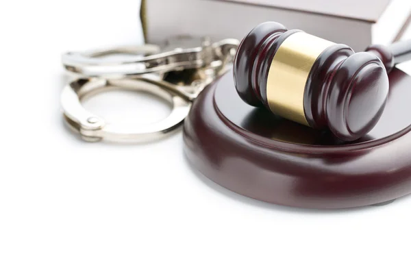 Handcuffs and judge gavel Royalty Free Stock Photos