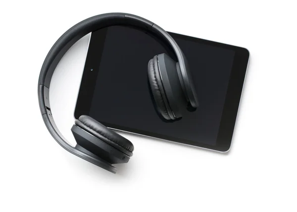 Fones de ouvido sem fio e tablet computador — Fotografia de Stock