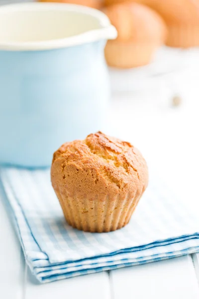 Sweet muffins on kitchen table — Stock Photo, Image