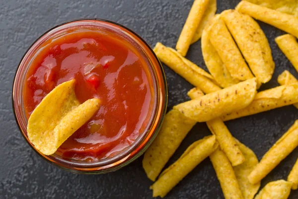 Rolled nacho chips and salsa dip — Stock Photo, Image