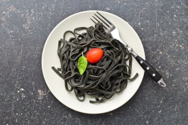 cooked black noodles with squid sepia ink clipart