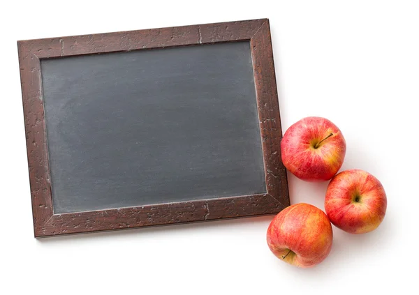 Autumn apples and chalkboard — Stock Photo, Image