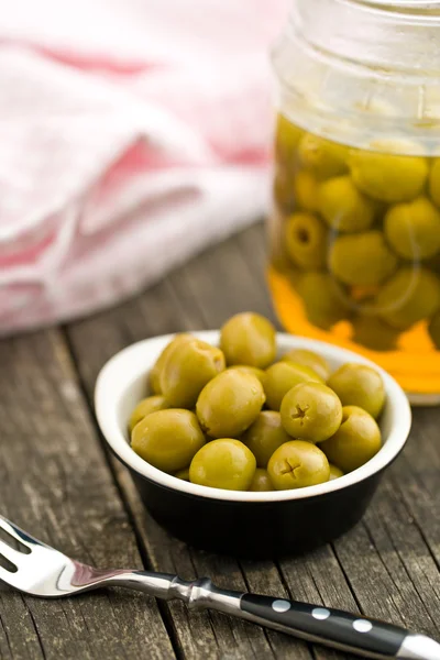 Pitted green olives in bowl — Stock Photo, Image