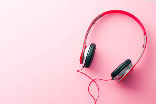 Red headphones on pink background — Stock Photo, Image