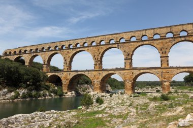 Pont du Gard is an old Roman aqueduct near Nimes in Southern France clipart