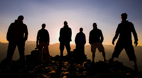 Men standing on rock — Stock Photo, Image