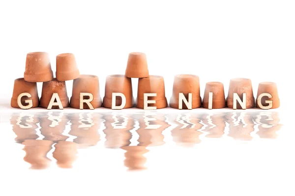 Giardinaggio parola logo design con pentole — Foto Stock