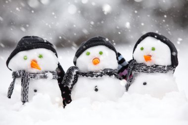 Three cute snowmen clipart