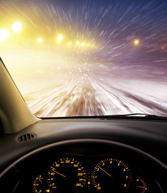 snow-covered road at night clipart