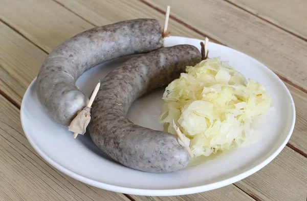 Sausage with sauerkraut — Stock Photo, Image