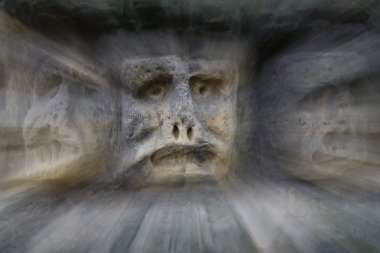 Bizarre Stone Heads - Rock Sculptures - in zoom clipart