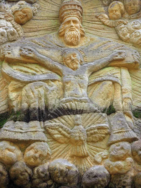 Relief of the Holy Trinity - stone altar carved in sandstone cli — Stock Photo, Image
