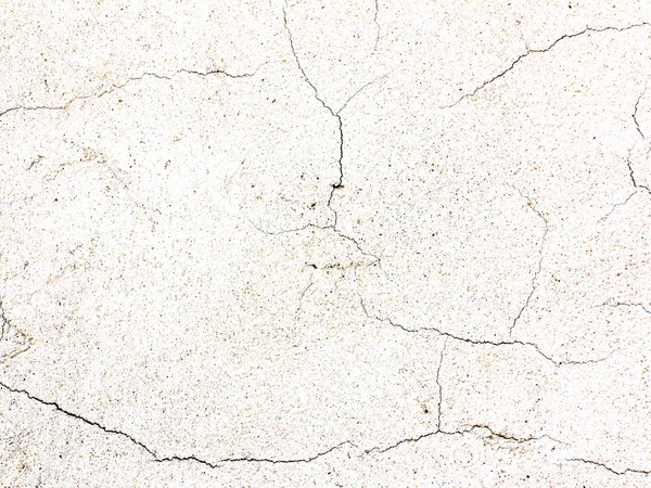 Cracked surface of rough plaster