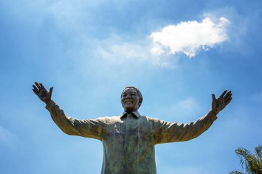 Pretoria, South Africa - 4th November 2016: Giant bronze 9statue of Nelson Mandela, former president of South Africa and anti-apartheid activist. This stands in the grounds of the Union Building. clipart