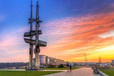 Gdynia sail monument near Baltic Sea at sunset clipart