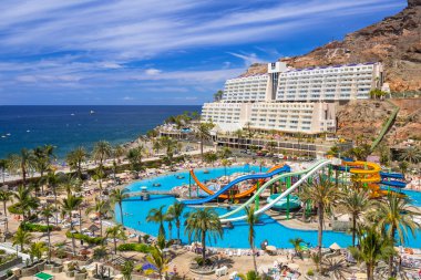 Tourists on sun holidays at the Lago Taurito aquapark in Taurito, Gran Canaria