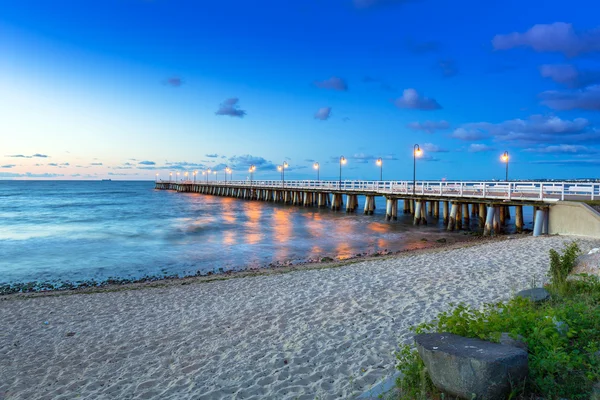 Wooden pier in Gdynia Orlowo at sunrise — Stockfoto