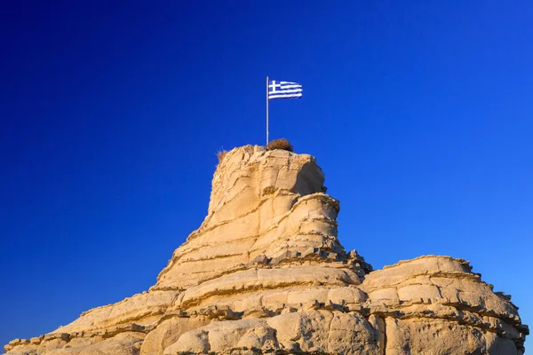 Greek flag on the rock — Stock Photo, Image