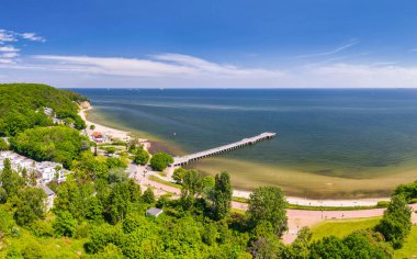 Aerial landscape of the beach and pier of the Baltic Sea in Gdynia Orlowo at summer, Poland. clipart