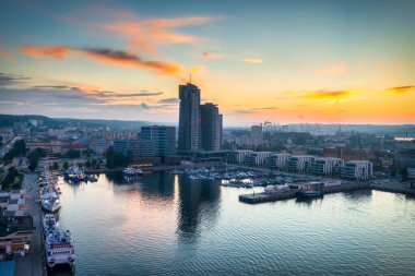 Aerial landscape of the harbor with modern architecture and Gdynia city inscription at sunset. Poland. clipart