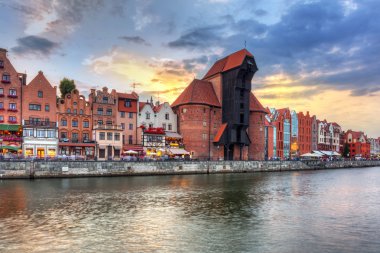 Gdansk at sunset with reflection in Motlawa river clipart