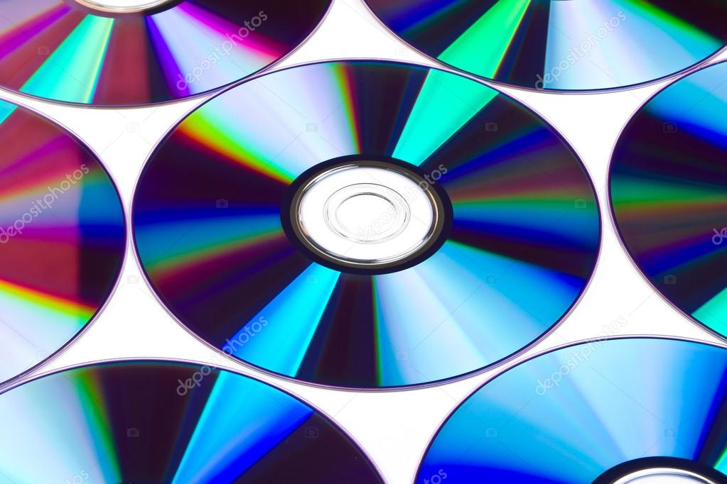 Cds and dvds on white background