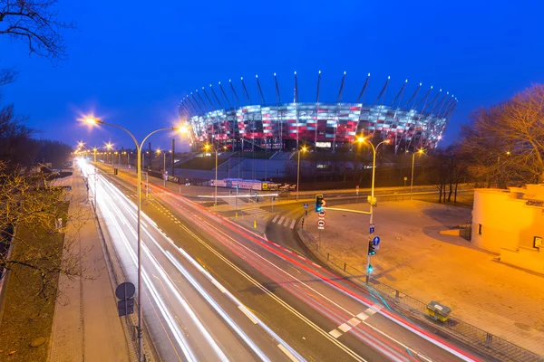 National Stadion i Warszawa belyst om natten - Stock-foto