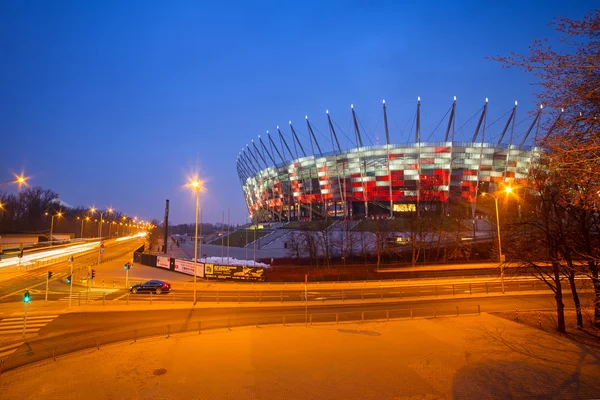 National Stadium in Warsaw illuminated at night by national colors, Poland — Stock Photo, Image