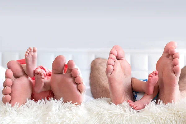 Four people family feet — Stock Photo, Image