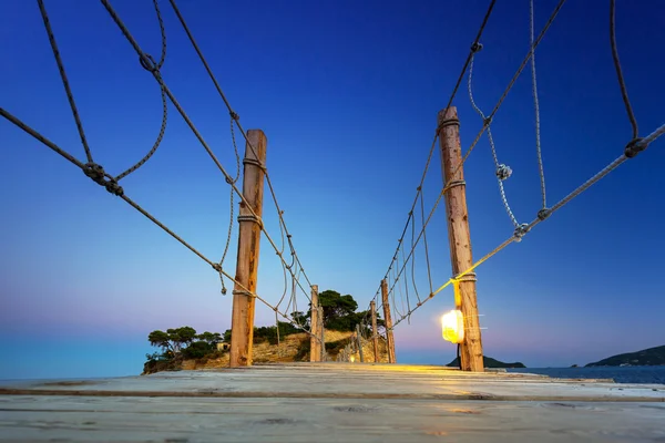 Hanging bridge to the island at night — Stock Photo, Image