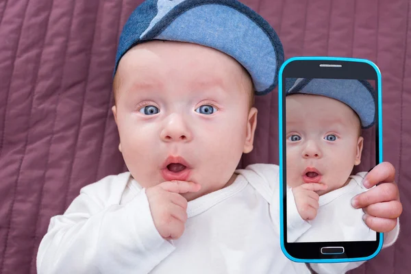 Baby boy taking selfie Stock Image